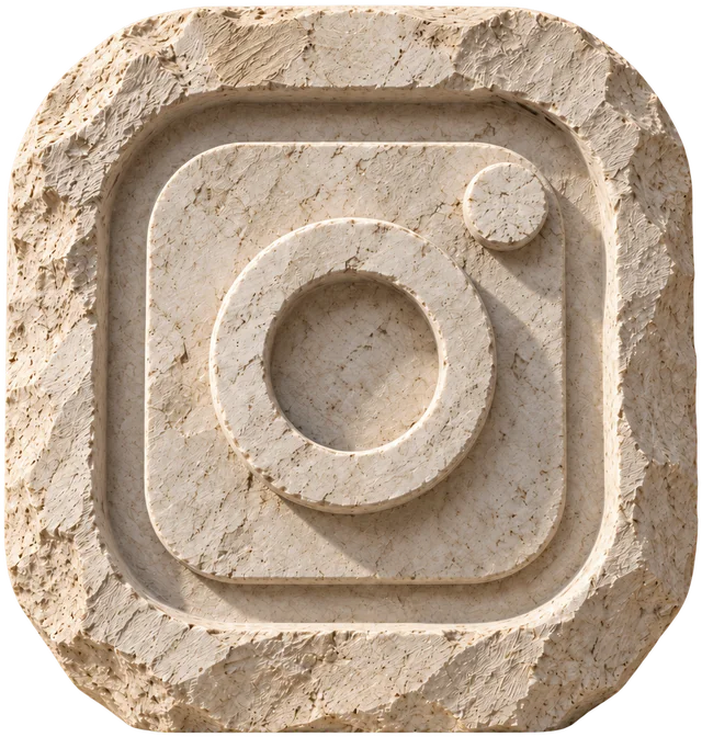 O ícone do Instagram esculpido em pedra.